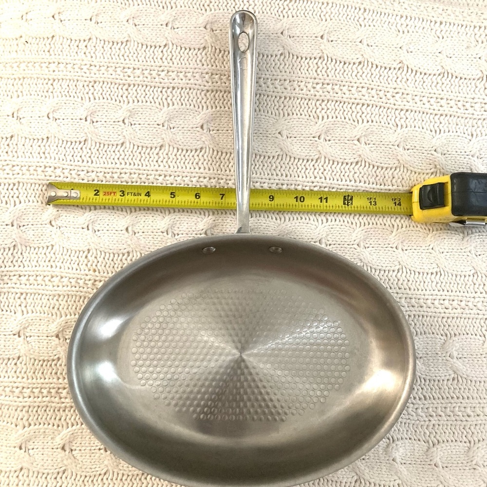All-clad 12 inch fish pan with dimpled bottom for easy release